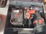 two electric tools in a box on a table