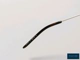 a close up of a pair of glasses on a white surface
