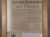 an old newspaper with a picture of a coat of arms on it