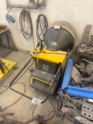 a room with a lot of tools and equipment on the floor