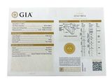 a close up of a piece of paper with a gold medal on it