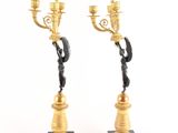 pair of antique bronze candlesticks on marble bases