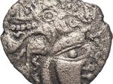 une pièce de monnaie en argent portant l'image d'un visage d'homme