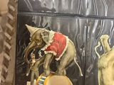 four different images of circus elephants on the back of a suitcase