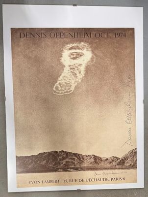 a poster on a wall with a picture of a cloud in the sky