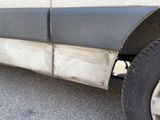 a close up of the side of a truck with the door open