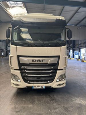 a picture of a white truck parked in a garage