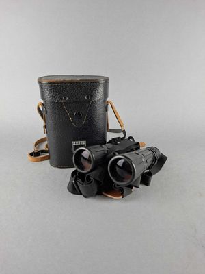 an old pair of binoculars sitting on top of a table