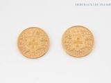 two gold coins with the image of a castle on them