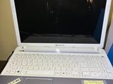 a laptop computer sitting on top of a desk