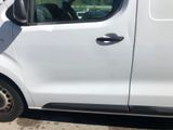 a small white van parked on the side of the road