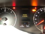 a close up of the dashboard of a car with the lights on