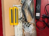 a box with a remote control and other items on a table