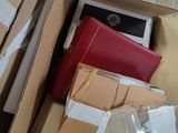 a box full of boxes and papers sitting on the floor