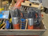 a wooden box filled with assorted tools in a garage