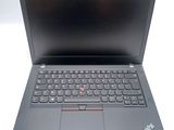a close up of a laptop with a keyboard on a white surface