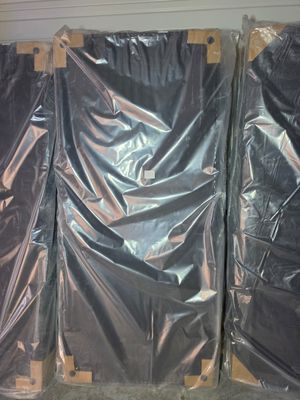 three pieces of plastic wrapped up on a pallet