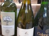 several bottles of wine are lined up on a table