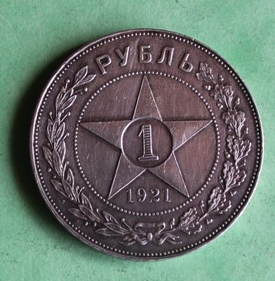 a close up of a coin with a star on it