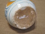 a close up of a vase on a table