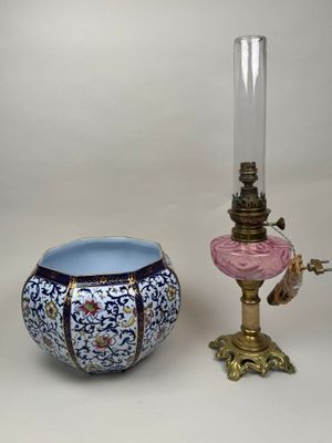 two vases and a lamp on a table