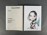an open book with a drawing of a woman on it