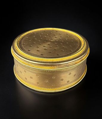 an image of a gold box on a black surface
