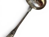 silver spoon on a white background with a spoon in the middle of it