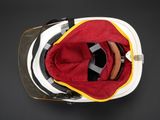 an overhead view of a fireman ' s helmet with a red and yellow lining
