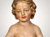 statue of a child holding a bowl of water