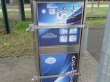 a picture of a public phone booth on the side of the road