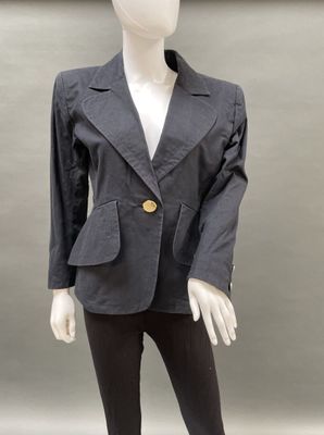 a mannequin wearing a gray jacket and black pants