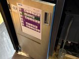 a stainless steel dishwasher that is open on the counter