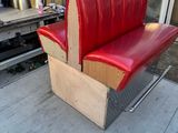 a bench made out of a box on the sidewalk