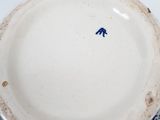 a blue and white plate with a blue bird on it