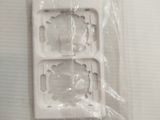 a picture of a plastic tray that has two pieces of plastic on top of it