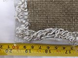 measuring the length of a pillow with a tape measure tape