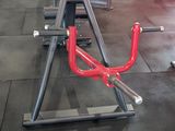 a gym with a lot of machines in the room