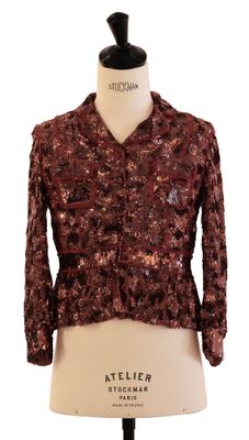a close up of a mannequin torso with a jacket on it