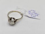a close up of a diamond ring with a tag on it