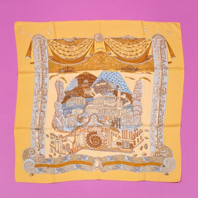 an image of a yellow scarf with a picture of a castle on it