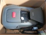 a vacuum that is sitting in a box on the floor