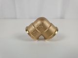 a close up of a brass pipe on a white surface