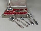 silverware in a silver case with a red brush and spoons