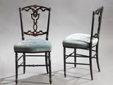 pair of black chairs with blue upholstered upholstered cushions