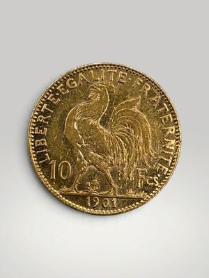 a close up of a gold coin with a rooster on it