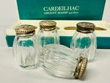 three glass salt and pepper shakers in a box
