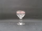 a wine glass that is sitting on a table