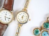 two watches sitting next to each other on a table