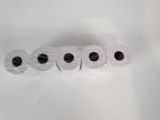 several rolls of toilet paper are lined up on a white surface